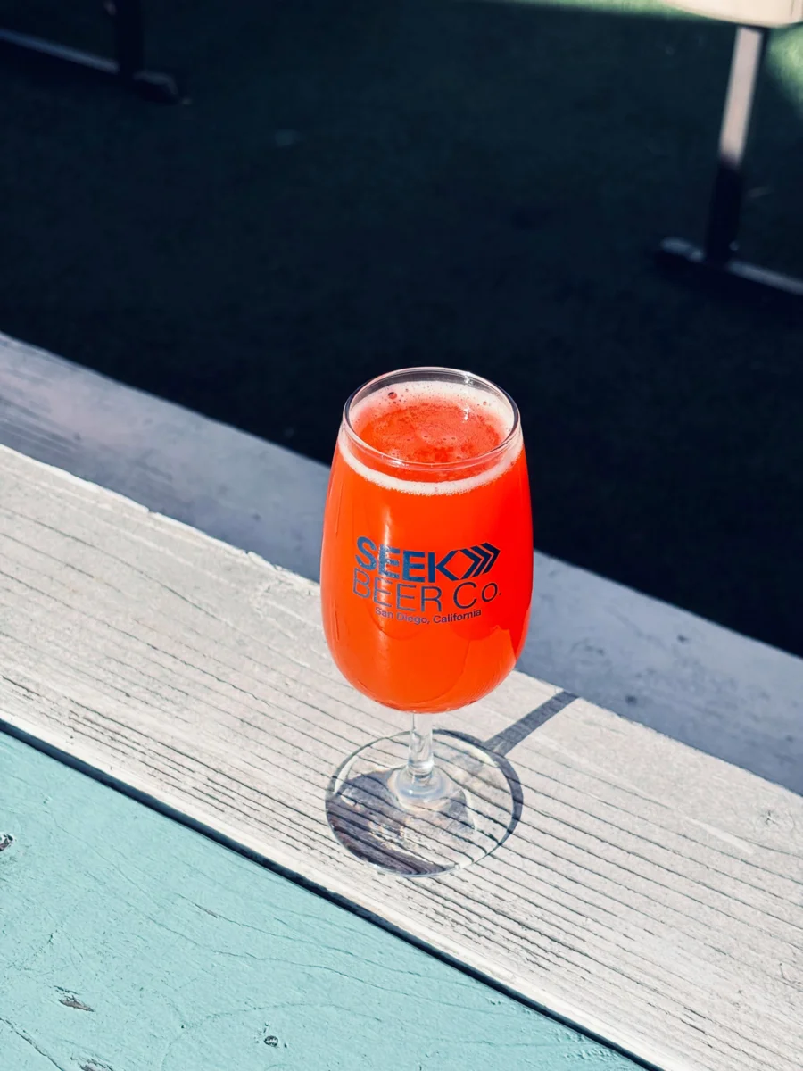 A ruby fruited pour in a Seek Beer Co. stem glass